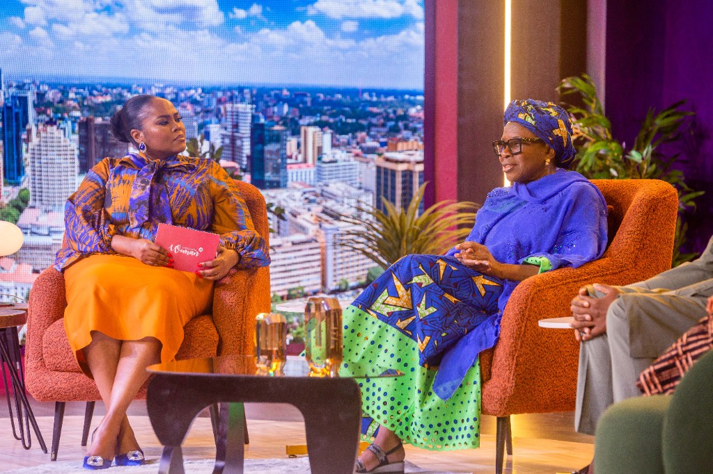 Abosede George-Ogan gesturing while speaking on a premium stage